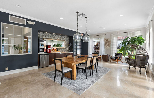 A dining room with a wooden table and chairs.