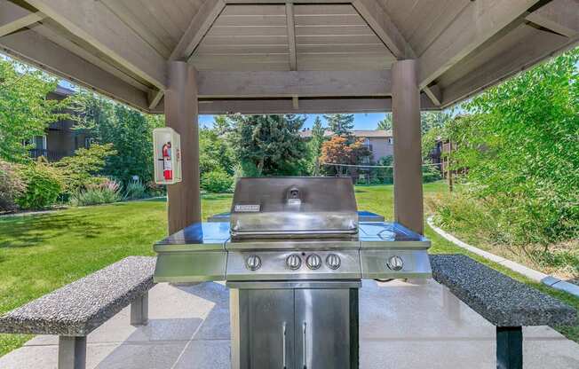 a gas grill is available in the back patio of the home at Lincoln Village Apartments, Spokane, WA 99208