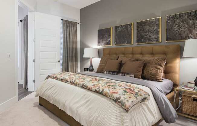 King Sized Bed In Bedroom at The Alastair at Aria Village, Sandy Springs, GA