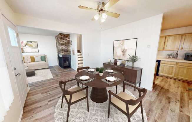 an open living room and dining room with a table and chairs