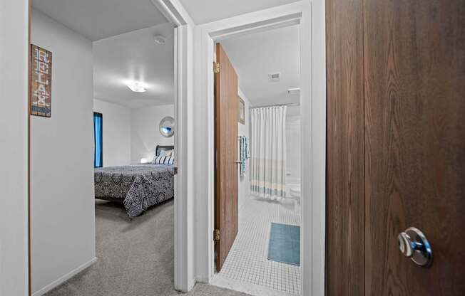 Bedroom/bathroom at Westwood Village Apartments in Westland, MI