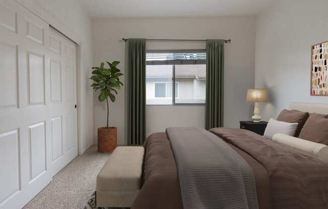 a bedroom with a bed and a window with green curtains