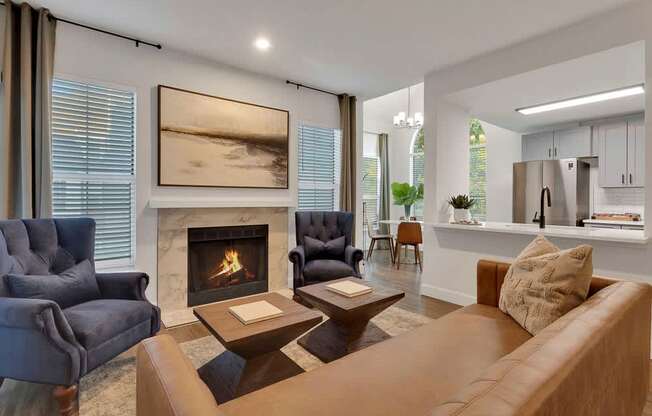 A living room with a fireplace and a painting on the wall.