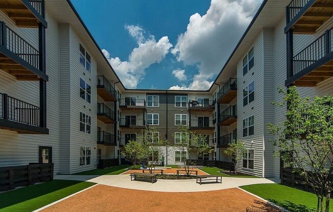 a courtyard in the middle of an apartment building