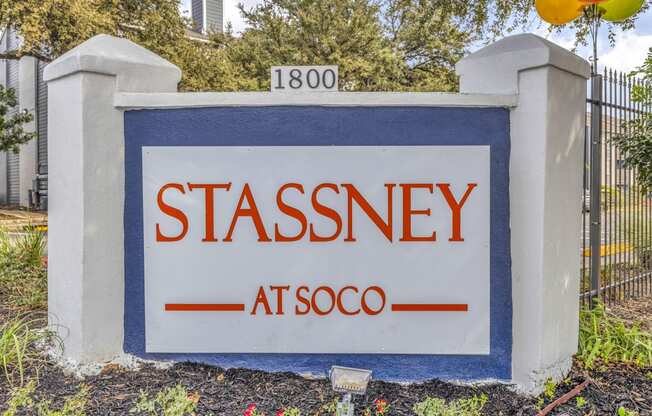 a sign in front of a fence