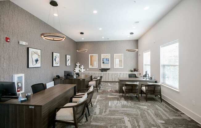 A reception area with a desk and chairs.