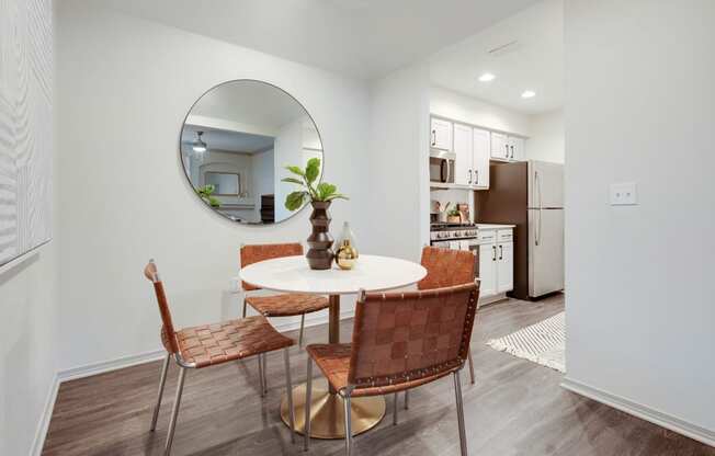 a living room with a table and a mirror in it at The Olivine, Texas, 78727
