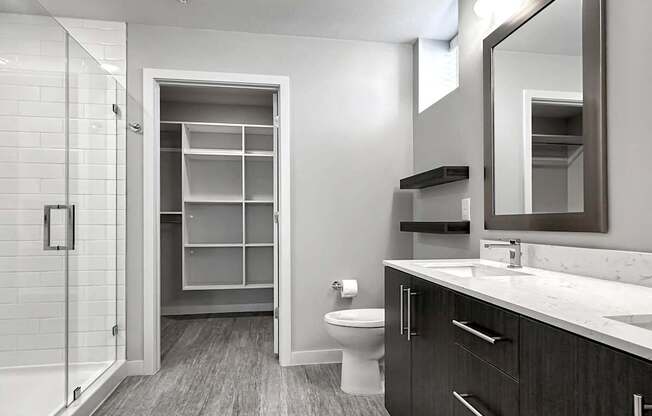 Frameless walk-in showers and large closets with custom shelving