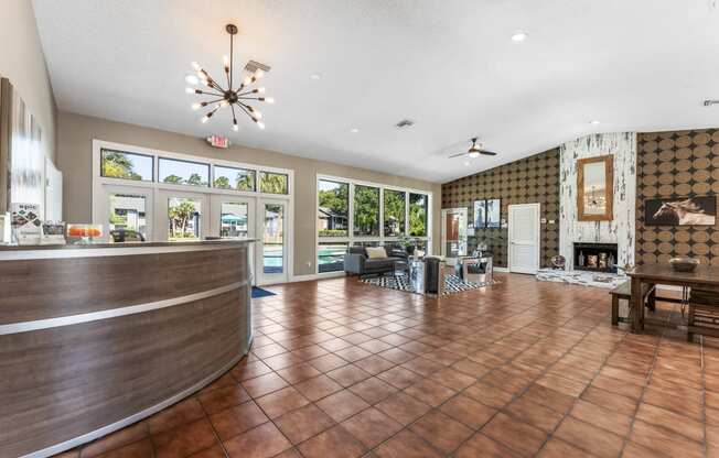 a lobby with a reception desk and a fire place