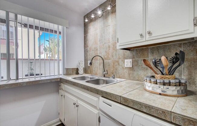 a kitchen with a sink and a window