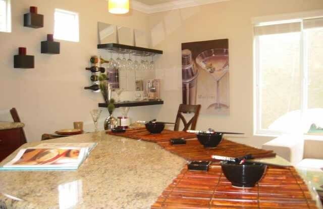 Beautiful upscale top floor 1 bedroom & 1 bath open concept condo - bright end unit with one reserved parking space. Amenities include: granite kitchen and bath, cherry wood cabinets, SS appliances, in unit washer & dryer, mirrored closet with custom cont