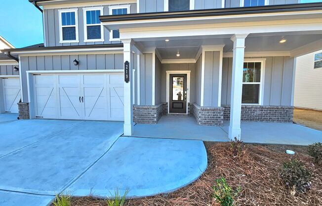 Incredible Farmhouse Style Home with Three Car Garage