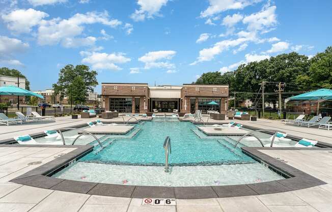 a swimming pool with a building in the background