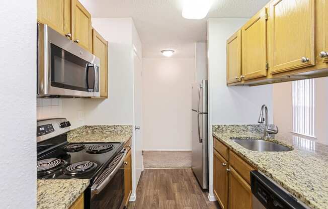 This is a photo of the kitchen in the 1245 square foot 2 bedroom, 2 bath apartment at Cambridge Court Apartments in Dallas, TX.