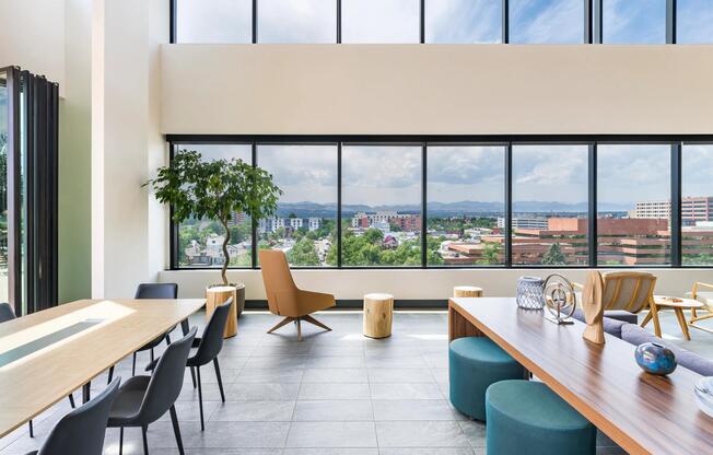 Our airy indoor-outdoor lounge with high ceilings and wide-open views, offers a comfortable setting for everyday moments and shared experiences.