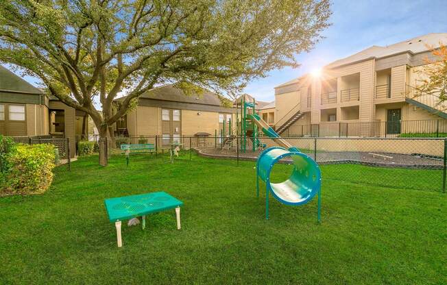 our apartments showcase a dog park with a playground