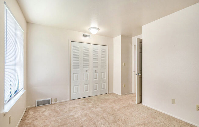 spacious bedroom with large closet at West Wind Apartments in Fort Wayne, IN