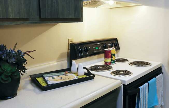 a kitchen with a white stove top oven next to a white counter top