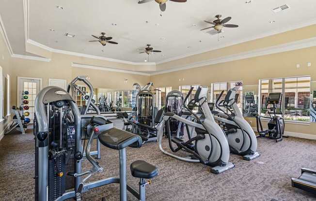 A spacious gym with a variety of exercise equipment.