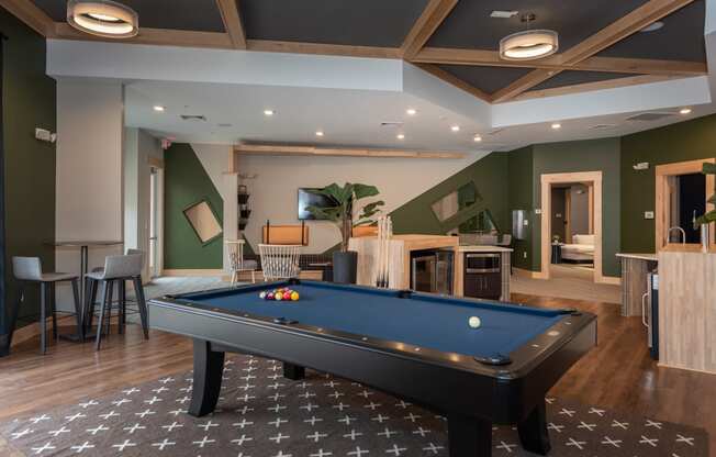 a rec room with a pool table and a flat screen tv at The Bend Arbordale, Virginia, 23188