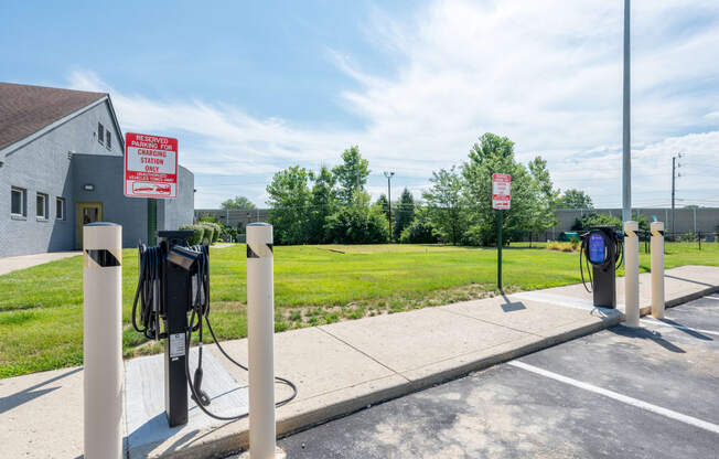 a charging station at a gas station in a parking lot