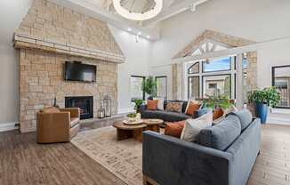 Resident clubhouse lounge with fireplace - Grand Centennial Apartments
