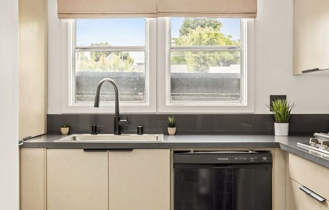 A 4 Bedroom, 3 Bathroom apartment with common areas and a fully functional kitchen at 1476 Malcolm Ave.