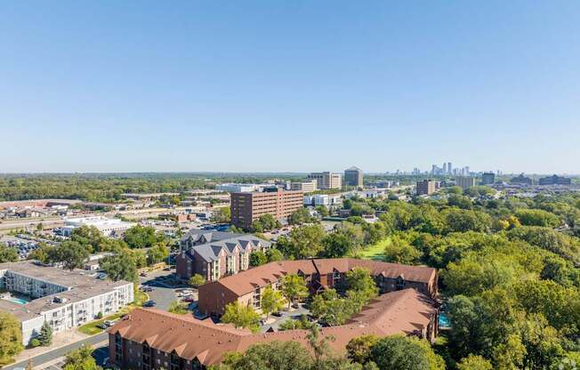 an aerial view of a city with buildings and trees