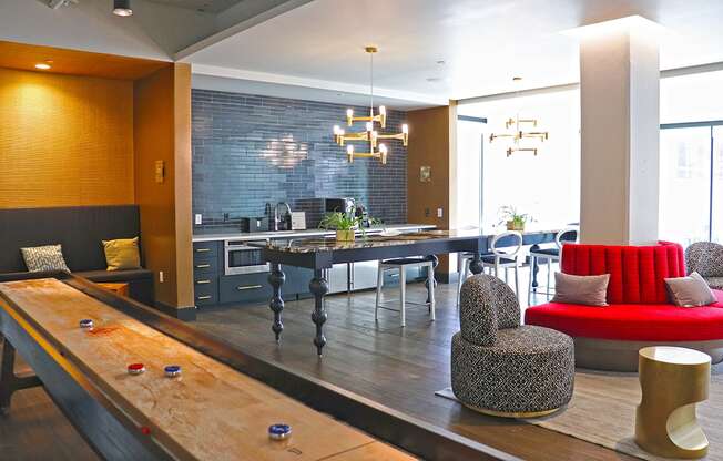 Euclid clubroom with shuffle board, seating and coffee bar