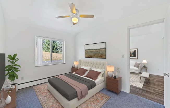 a bedroom with a bed and a ceiling fan