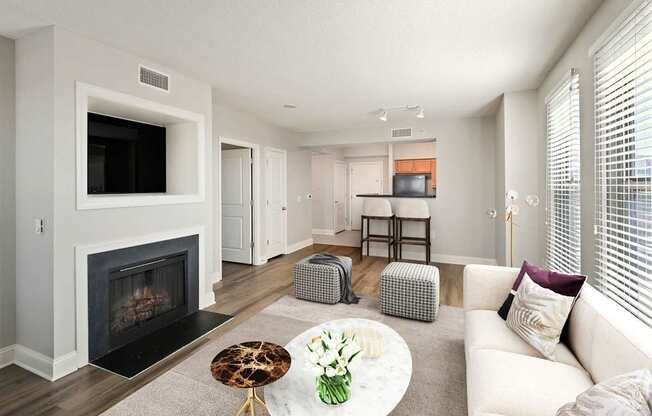 A living room with a fireplace and a television