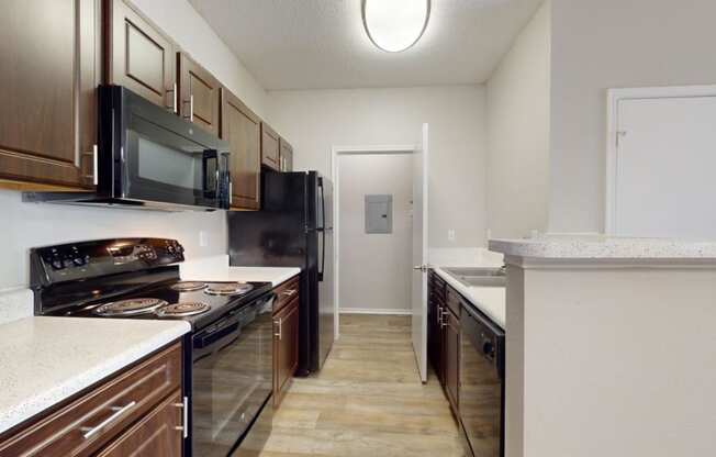 a kitchen with a stove and a microwave