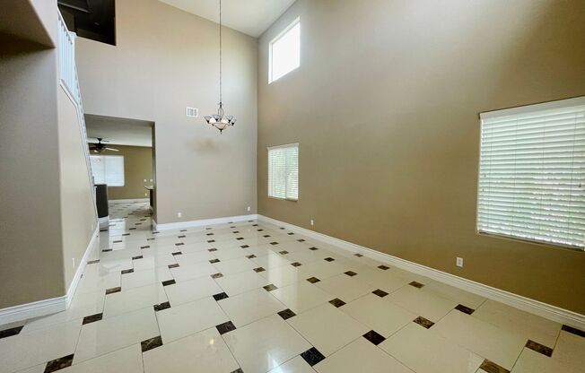 Stunning golf course view! Beautiful home is located on golf course inside Rhodes Ranch guard gated community! Master bedroom is downstairs!