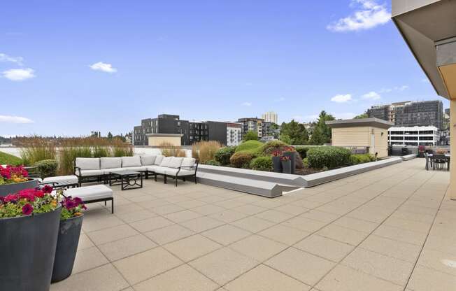 Rooftop Lounge for Residents with couches and tables at Villaggio Apartment Homes, WA 98402