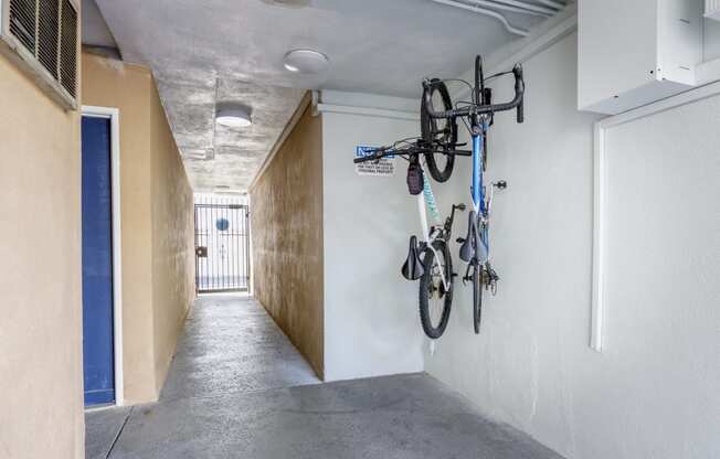 a hallway with bikes hanging on the wall