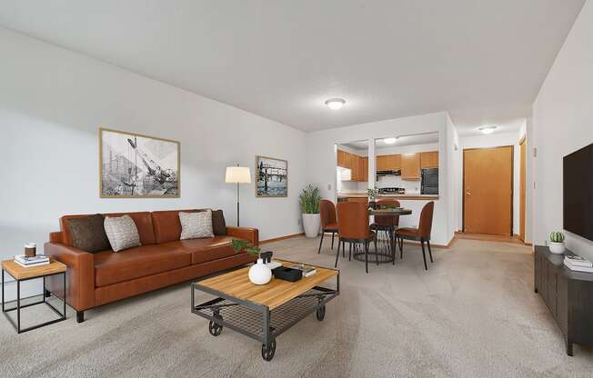 the living room of an apartment with a couch and a coffee table