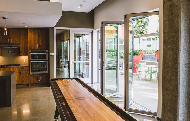 Open the folding glass doors and compete in a game of shuffleboard