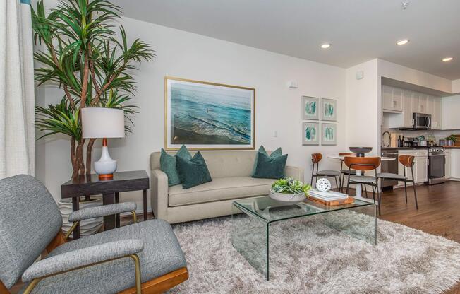 a living room filled with furniture and a large window