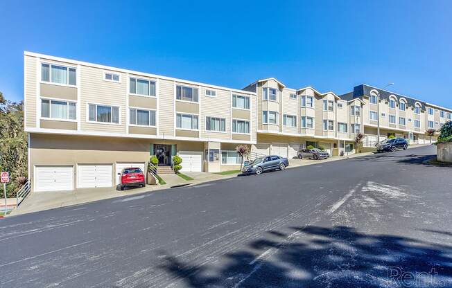 a large apartment building with a parking lot in front of it at Terrace View Apartments, Daly City 