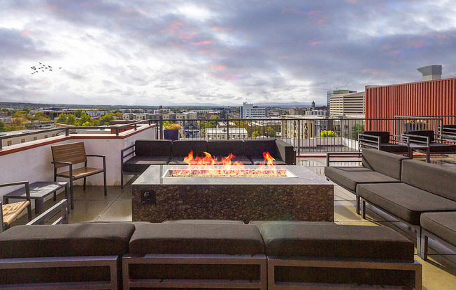 exterior fire place with couches at The Lotus Apartments in Downtown Salt Lake City, Utah