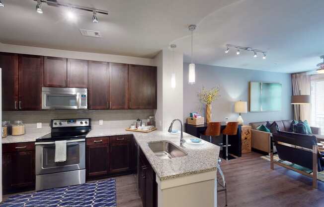 a kitchen and living room in a 555 waverly unit