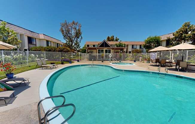 our apartments have a large pool with chairs and umbrellas