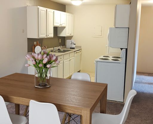 Kitchen and dining at Mason Hills Apartments in Mason, MI
