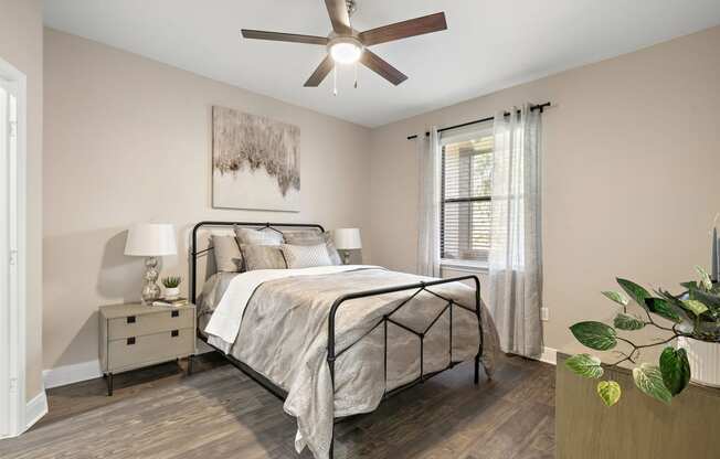 a bedroom with a ceiling fan and a bed at The Verandah, Texas