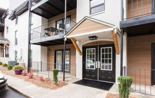 Apartment entrance with patio and balcony at Parkside Sandy Springs Atlanta, GA