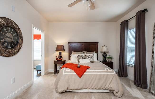 Furnished master bedroom with access to private bathroom at Riverstone apartments for rent in Macon, GA