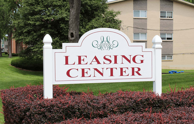 the leasing center sign in front of a building