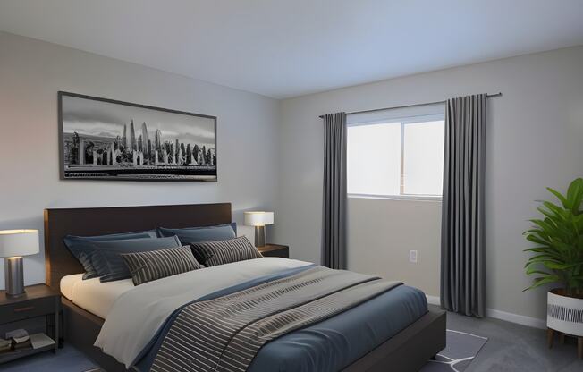 a bedroom with a bed with blue and white sheets and a black and white picture