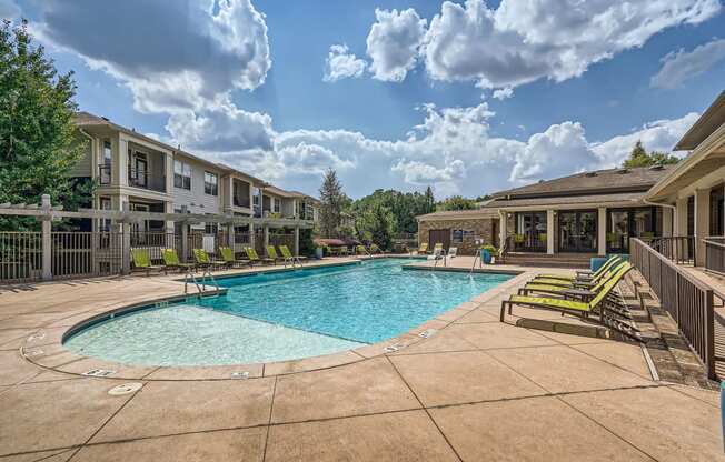 our apartments have a large swimming pool with lounge chairs