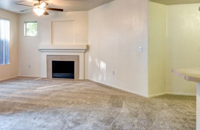 Ingleside Apartments Living Room with wall to wall carpet and fireplace